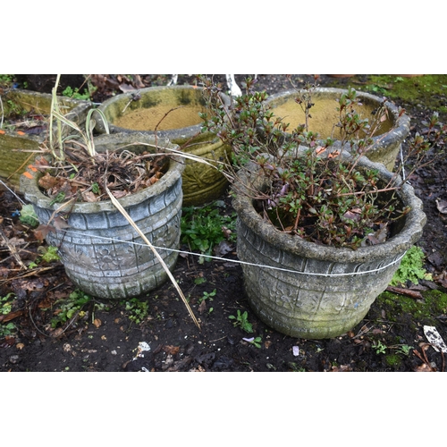 1011 - A PAIR OF WEATHERED COMPOSITE CIRCULAR PLANTERS, labelled Sandford stone, diameter 45cm x height 28c... 