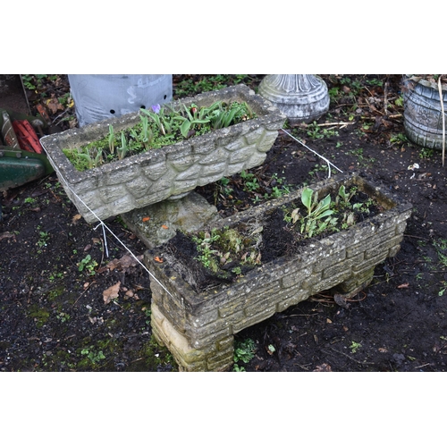 1014 - A NEAR PAIR OF WEATHERED COMPOSITE BRICK EFFECT RECTANGULAR PLANTER, one on a pair of stands, the ot... 