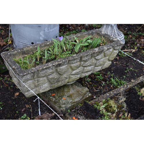 1014 - A NEAR PAIR OF WEATHERED COMPOSITE BRICK EFFECT RECTANGULAR PLANTER, one on a pair of stands, the ot... 