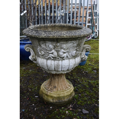 1017 - A PAIR OF WEATHERED COMPOSITE  CAMPAGNA GARDEN URNS, on separate bases, diameter 55cm x height 65cm ... 