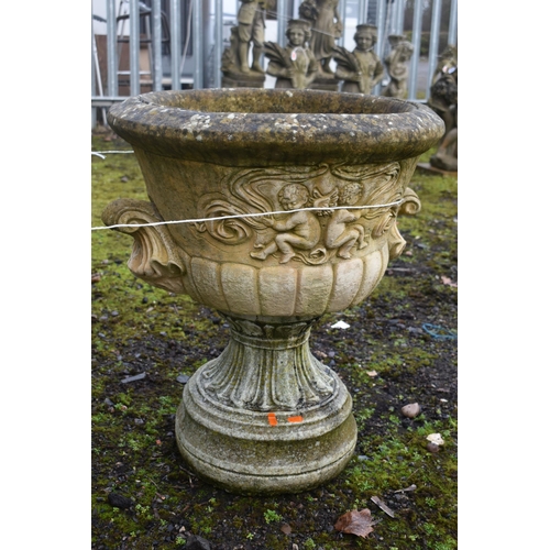 1017 - A PAIR OF WEATHERED COMPOSITE  CAMPAGNA GARDEN URNS, on separate bases, diameter 55cm x height 65cm ... 