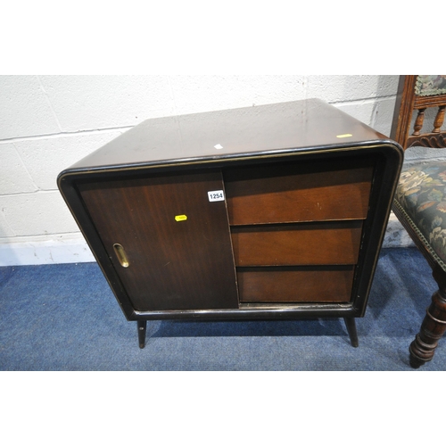 1254 - A 20TH CENTURY CABINET, with a single cupboard door and three drawers, on cylindrical tapered legs, ... 