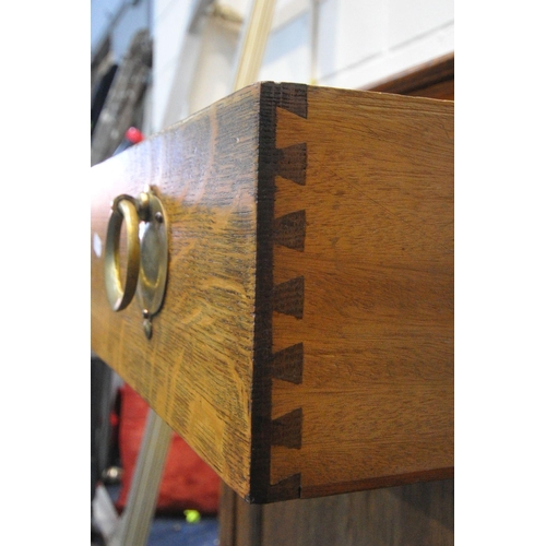 1266 - A 20TH CENTURY OAK SIDEBOARD, with a raised back, two drawers, above two cupboard doors, length 168c... 