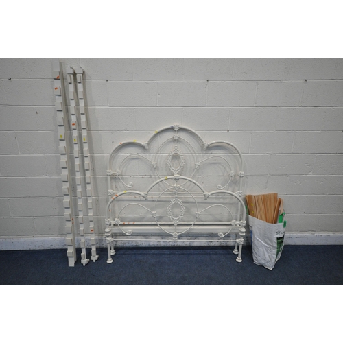 1283 - A WHITE PAINTED WROUGHT IRON 4FT6 BEDSTEAD, with side rails and slats (condition report: general sig... 