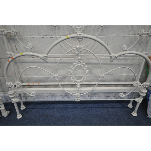 1283 - A WHITE PAINTED WROUGHT IRON 4FT6 BEDSTEAD, with side rails and slats (condition report: general sig... 