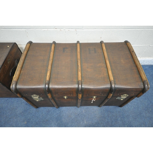 1290 - A LARGE VINTAGE CANVAS TRAVELING TRUNK, with bentwood banding, twin leather handles and a small plaq... 