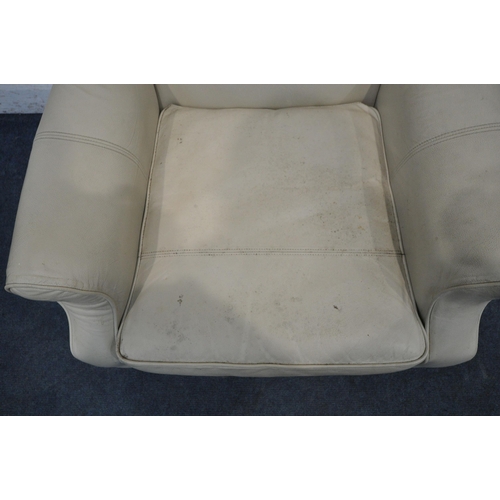 1291 - A CREAM LEATHER UPHOLSTERED WING BACK ARMCHAIR, width 82cm x depth 85cm x height 102cm (condition re... 