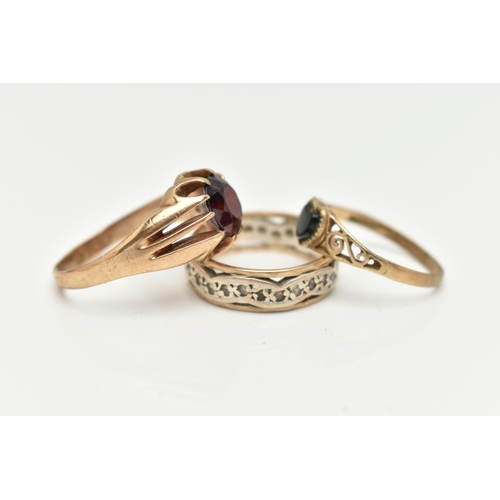 2 - A SELECTION OF THREE YELLOW METAL GEM SET RINGS, to include a garnet single stone ring, hallmarked 9... 