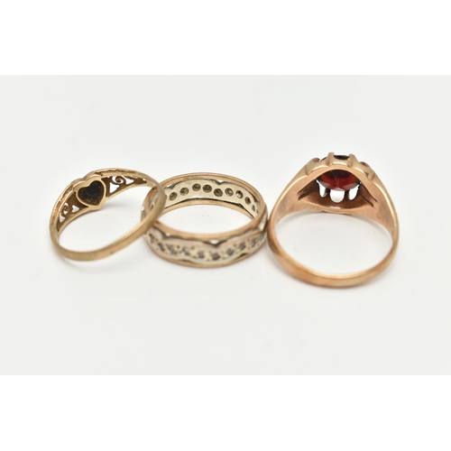 2 - A SELECTION OF THREE YELLOW METAL GEM SET RINGS, to include a garnet single stone ring, hallmarked 9... 