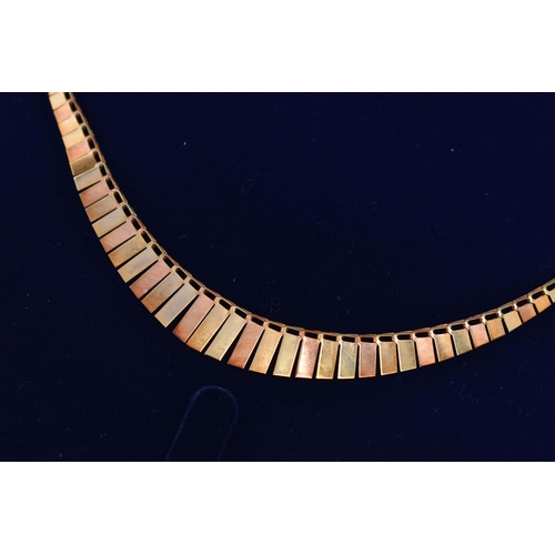 30 - A 9CT GOLD CLEOPATRA STYLE NECKLACE, a tri colour necklace comprised of graduated rectangular form p... 