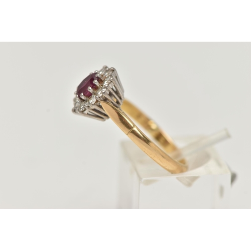 43 - AN 18CT GOLD RUBY AND DIAMOND CLUSTER RING, oval cluster centering on an oval cut ruby, in a ten cla... 