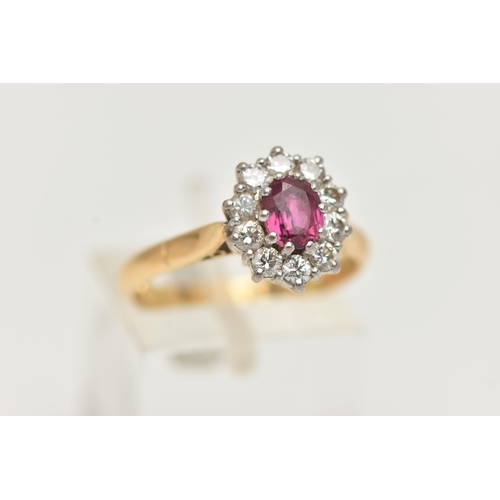 43 - AN 18CT GOLD RUBY AND DIAMOND CLUSTER RING, oval cluster centering on an oval cut ruby, in a ten cla... 