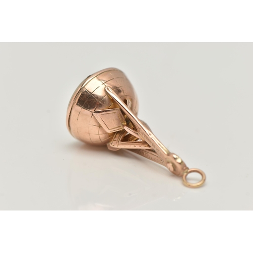 73 - AN EARLY 20TH CENTURY, 9CT ROSE GOLD MASONIC FOB SEAL, compass and tools grip, on a round base set w... 