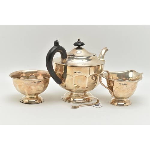 102 - AN EDWARDIAN SILVER THREE PIECE TEA SET, faceted design, comprising of a teapot, fitted with an ebon... 