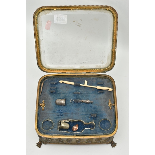 126 - A FRENCH JEWELLERY CASKET, an embossed brass box with glass viewing panel to the hinged lid, removab... 