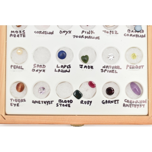 87 - A BOXED GEMSTONE SPECIMEN SET, the thirty piece set includes sapphire, fire opal, pink tourmaline, s... 