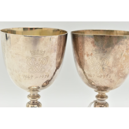 92 - A PAIR OF ELIZABETH II SILVER COMMEMORATIVE GOBLETS, polished cups with gilt interior, engraved 'EII... 