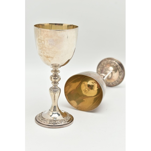 92 - A PAIR OF ELIZABETH II SILVER COMMEMORATIVE GOBLETS, polished cups with gilt interior, engraved 'EII... 