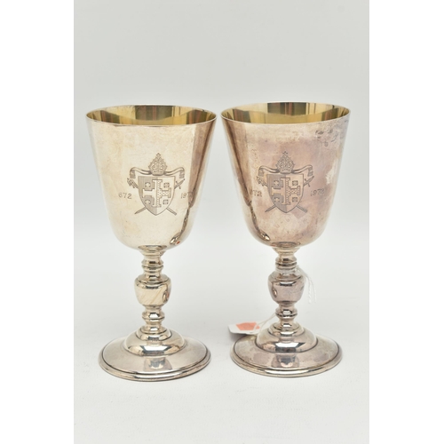 95 - A PAIR OF ELIZABETH II SILVER GOBLETS, tapered design with engraved crest, stamped '672 1972', knopp... 