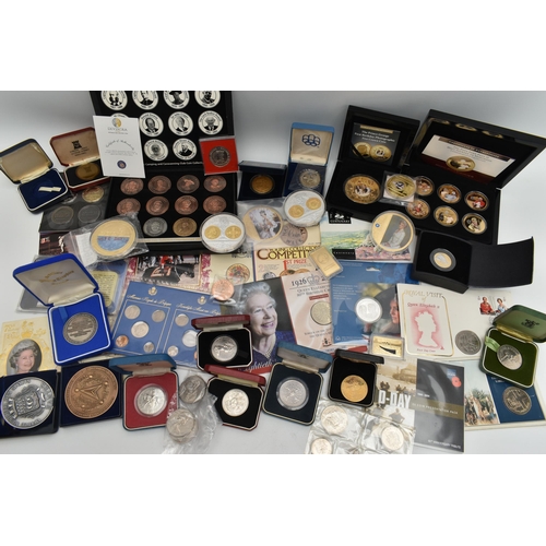 143 - A PLASTIC TUB OF MAINLY COMMEMORATIVE COINAGE, to include several large 110 gram pictorial commemora... 