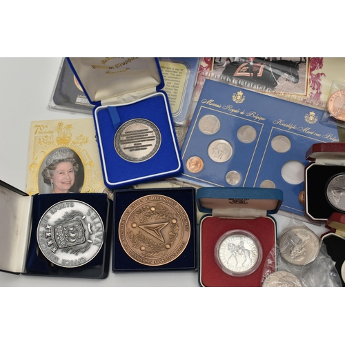 143 - A PLASTIC TUB OF MAINLY COMMEMORATIVE COINAGE, to include several large 110 gram pictorial commemora... 