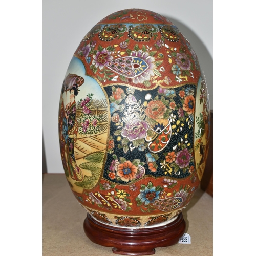 333 - A GIANT JAPANESE PORCELAIN 'SATSUMA' EGG, hand painted decoration of two Geisha girls and an orchid ... 