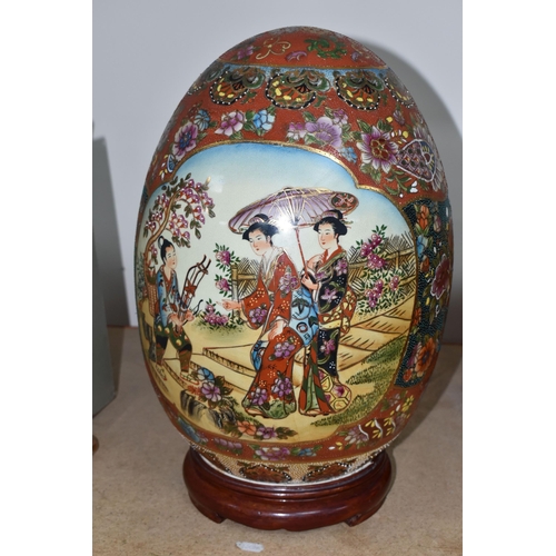 333 - A GIANT JAPANESE PORCELAIN 'SATSUMA' EGG, hand painted decoration of two Geisha girls and an orchid ... 