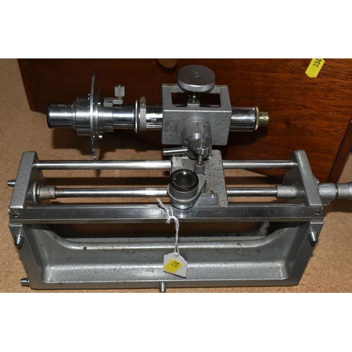 334 - TWO PRECISION OPTICAL MEASURING INSTRUMENTS, comprising a J. Swift & Son model 31287 with a micromet... 