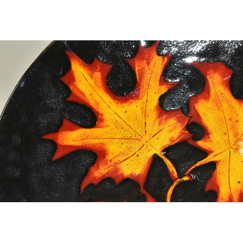 346 - TWO MODERN POOLE POTTERY CHARGERS, comprising an 'Autumn Leaves' charger, diameter 40.5cm and a  red... 