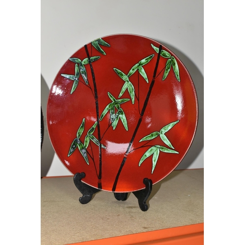 346 - TWO MODERN POOLE POTTERY CHARGERS, comprising an 'Autumn Leaves' charger, diameter 40.5cm and a  red... 