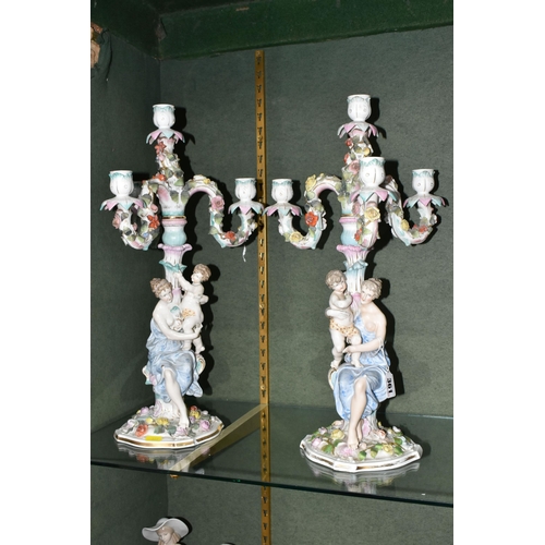 361 - A PAIR OF CONTINENTAL FOUR FLAME FIGURAL CANDELABRA, depicting a woman and child beside the central ... 