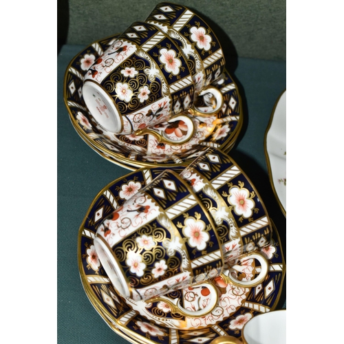 376 - A GROUP OF ROYAL CROWN DERBY IMARI 2451 TEA CUPS, SAUCERS AND A TRINKET DISH, comprising a boxed lim... 