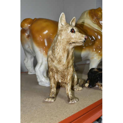 388 - A GROUP OF CERAMIC DOGS, comprising two Winstanley dogs comprising an Alsatian and Dachshund, a larg... 