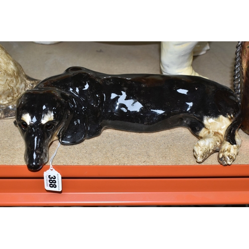 388 - A GROUP OF CERAMIC DOGS, comprising two Winstanley dogs comprising an Alsatian and Dachshund, a larg... 