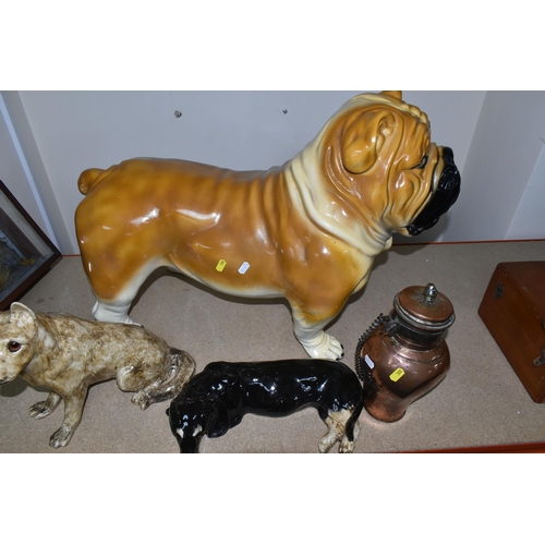 388 - A GROUP OF CERAMIC DOGS, comprising two Winstanley dogs comprising an Alsatian and Dachshund, a larg... 