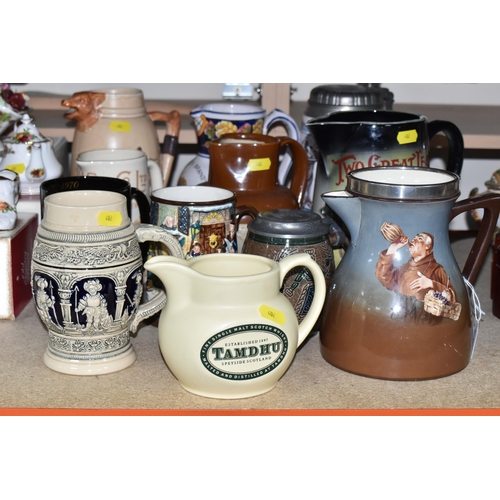 402 - A SELECTION OF DECORATIVE JUGS AND TANKARDS ETC, to include a Taylor Tunnicliffe jug with silver rim... 