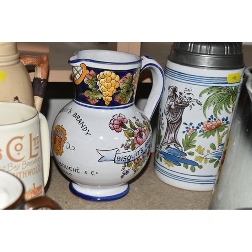 402 - A SELECTION OF DECORATIVE JUGS AND TANKARDS ETC, to include a Taylor Tunnicliffe jug with silver rim... 