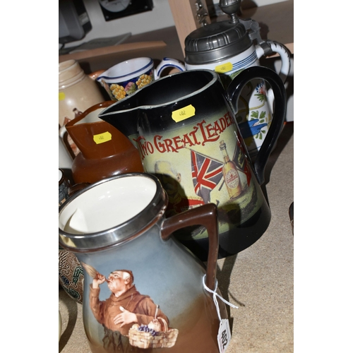 402 - A SELECTION OF DECORATIVE JUGS AND TANKARDS ETC, to include a Taylor Tunnicliffe jug with silver rim... 