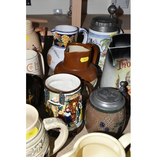 402 - A SELECTION OF DECORATIVE JUGS AND TANKARDS ETC, to include a Taylor Tunnicliffe jug with silver rim... 