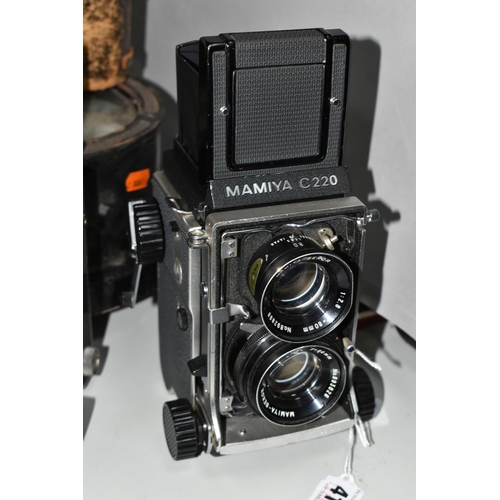 414 - VINTAGE MAMIYA ROLL FILM CAMERAS AND LENSES, comprising a Mamiya C220 Professional camera fitted wit... 