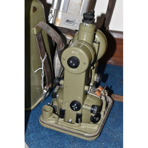 451 - A CASED KERN SWISS THEODOLITE AND TRIPOD, the theodolite model K1-A with a green finish, together wi... 