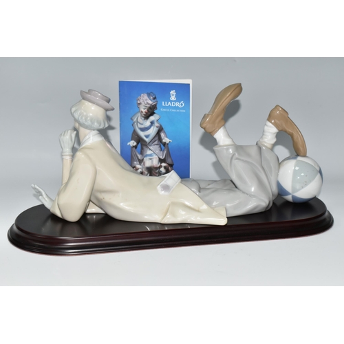 453 - A LLADRO CLOWN, no 4618, designed by Salvador Furio in 1970, the figure lying on his front with head... 