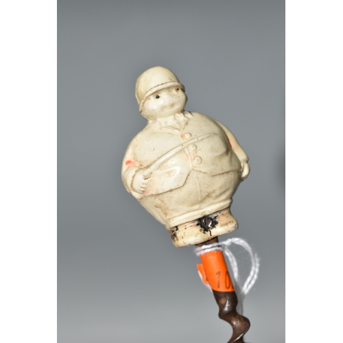 457 - A 1920S NOVELTY CORKSCREW, the celluloid handle in the form of a chubby huntsman, height of figure 5... 