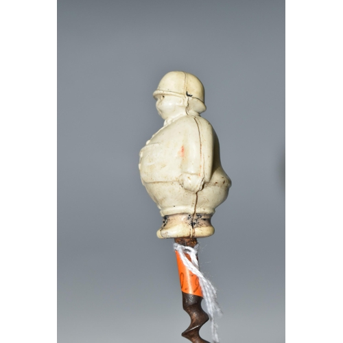 457 - A 1920S NOVELTY CORKSCREW, the celluloid handle in the form of a chubby huntsman, height of figure 5... 