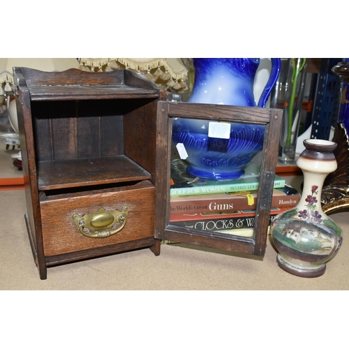 484 - AN EDWARDIAN SMOKER'S CABINET,  oak cased, glazed door and brass handled internal drawer, height 38c... 