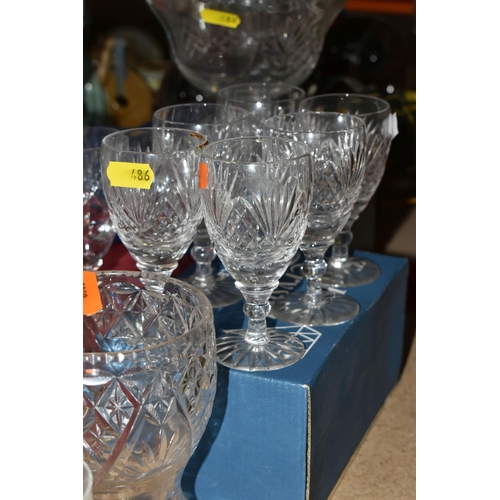 486 - A GROUP OF CUT CRYSTAL AND COLOURED GLASSWARE, comprising a boxed set of six Tutbury Crystal port gl... 