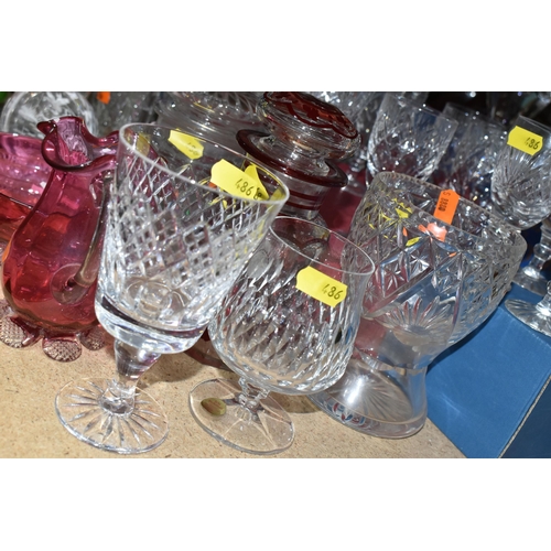 486 - A GROUP OF CUT CRYSTAL AND COLOURED GLASSWARE, comprising a boxed set of six Tutbury Crystal port gl... 