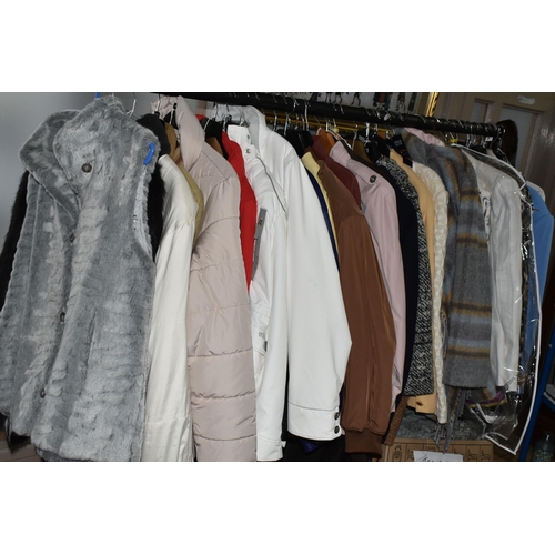 519 - FIFTY LOOSE ITEMS OF MODERN LADIES' CLOTHING, comprising overcoats, jackets, waterproof jackets, qui... 