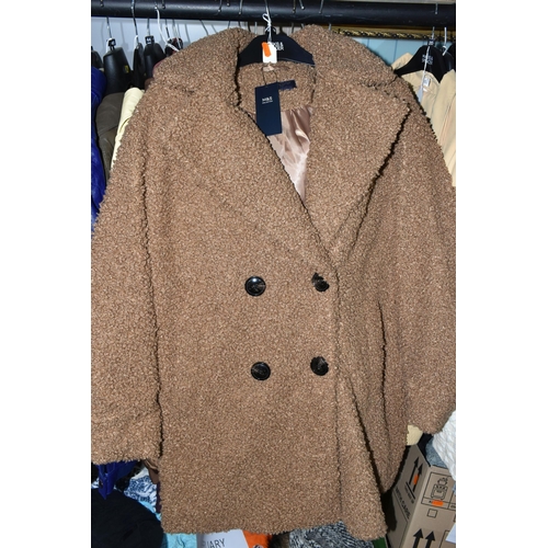 519 - FIFTY LOOSE ITEMS OF MODERN LADIES' CLOTHING, comprising overcoats, jackets, waterproof jackets, qui... 