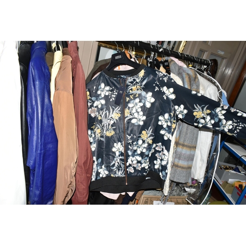 519 - FIFTY LOOSE ITEMS OF MODERN LADIES' CLOTHING, comprising overcoats, jackets, waterproof jackets, qui... 